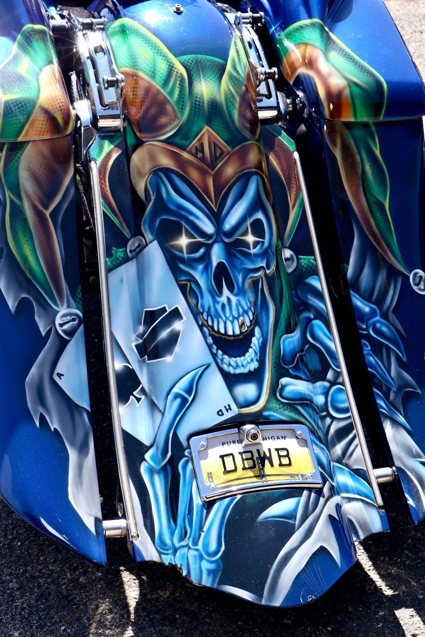 Blue skull artwork on a motorcycle