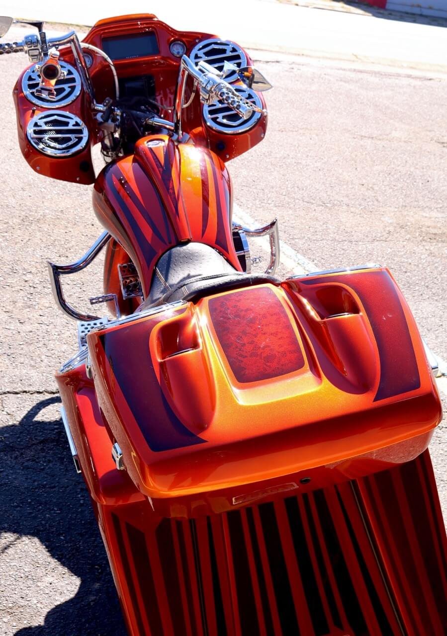 Rear view of an orange custom motorcycle