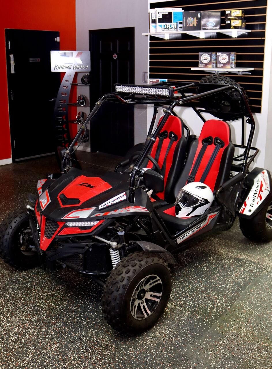 Red Trail Master vehicle inside the shop